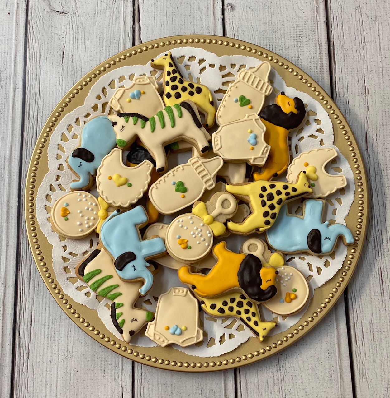 cookie tray, safari, baby, elephant, giraffe, lion, zebra, onesie, rattle, bottle, bib, ivory blue green gold brown mango yellow
